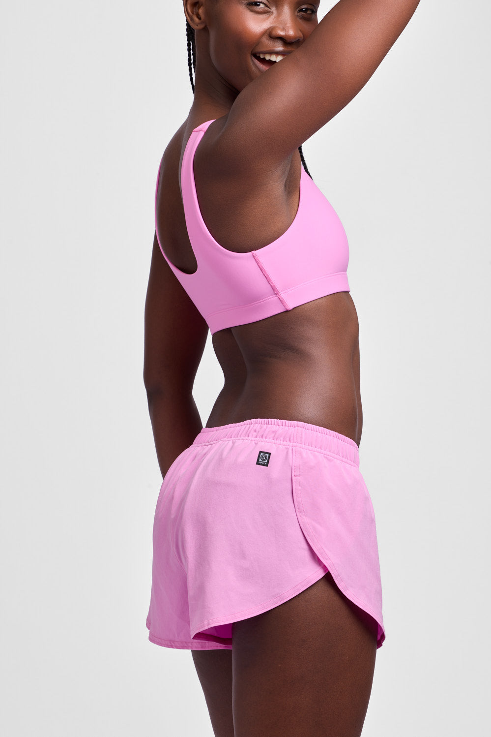 jolyn_womens_activewear-shorts_run_lizzie_pinky_2c-side_grey-studio_pdp_all.jpg